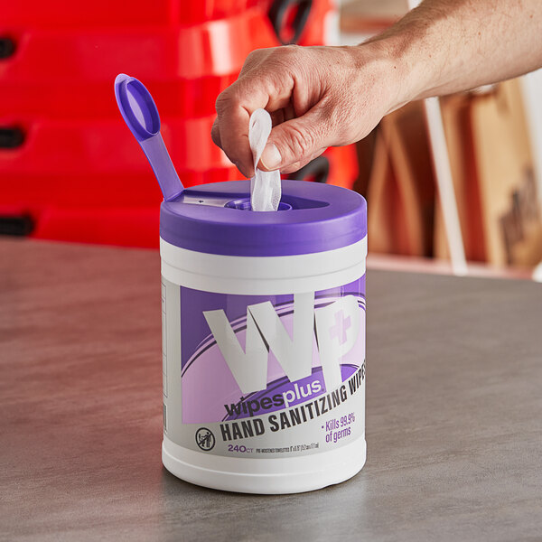 A white container of WipesPlus hand sanitizing wipes with a purple label.