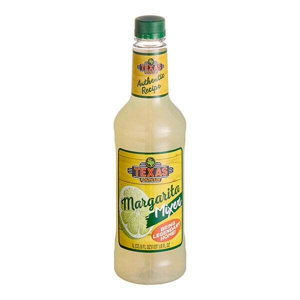 A yellow labeled bottle of Texas Roadhouse Margarita Mix.