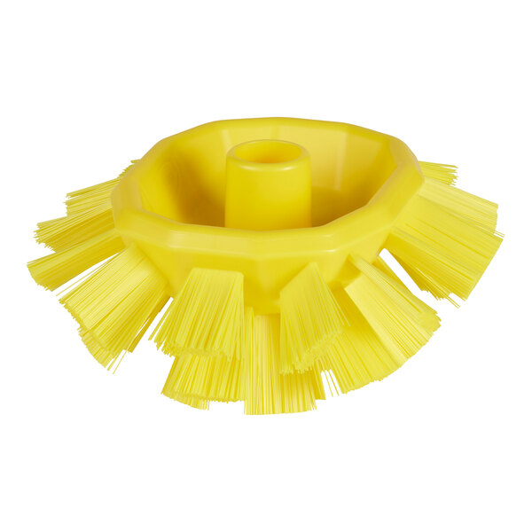 A yellow circular Vikan tank brush head with stiff bristles.