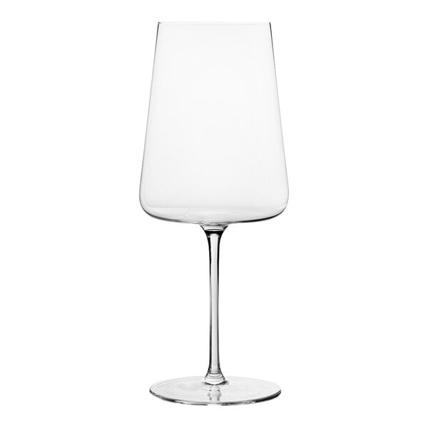 A close-up of a clear Chef & Sommelier wine glass with a stem and white rim.
