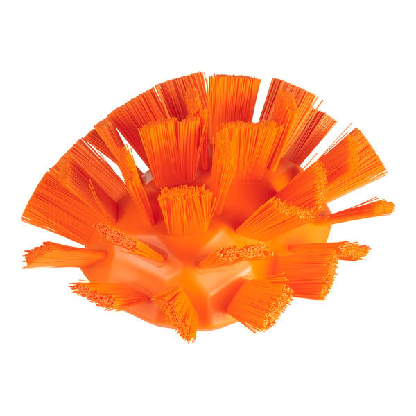 An orange Vikan tank brush head with stiff bristles.