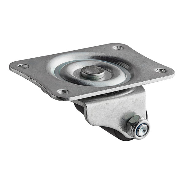 A metal plate with a metal wheel attached by a screw.