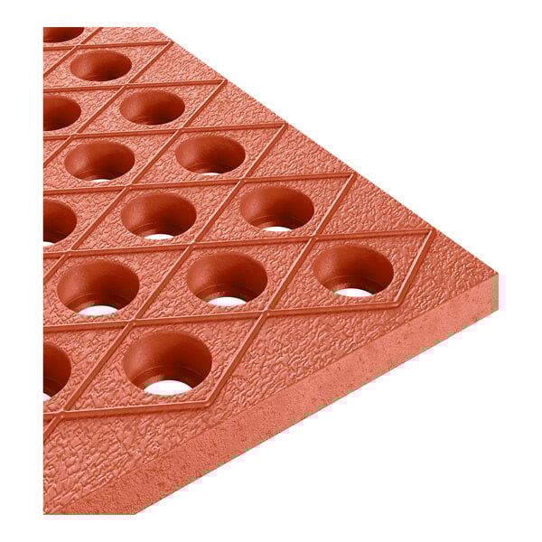 A red heavy-duty rubber floor mat with diamond patterns and circular holes, designed for grease resistance and anti-fatigue use.