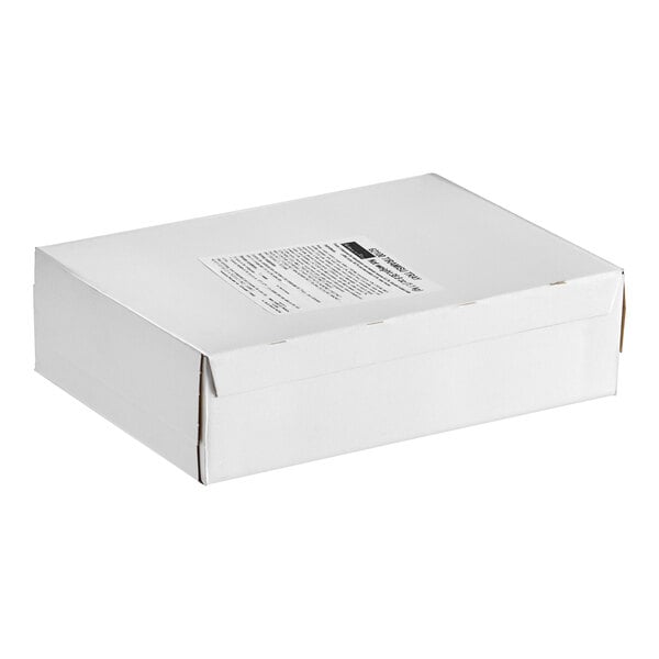 A white Toque Tiramisu cake box with a label on the top.