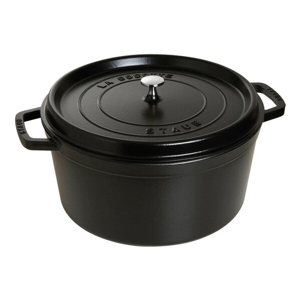 A black Staub enameled cast iron casserole with lid.