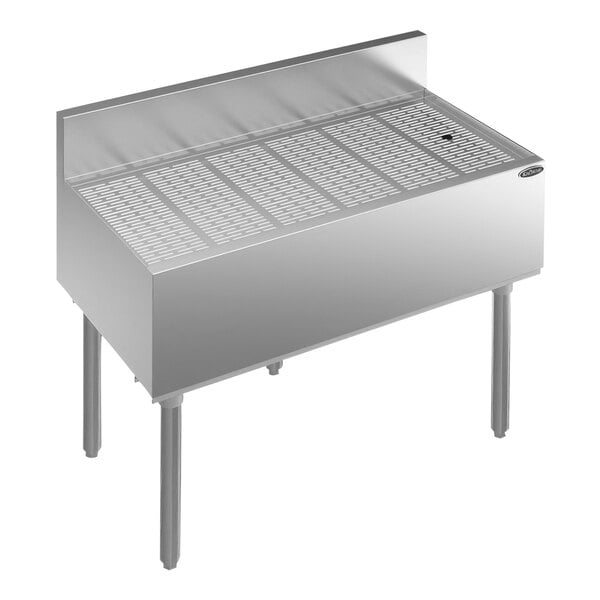 A Krowne stainless steel underbar drainboard with drain.