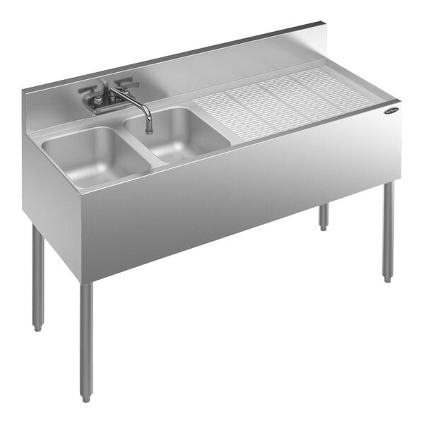 A Krowne Royal Series stainless steel 2 bowl underbar sink with faucet and right drainboard.