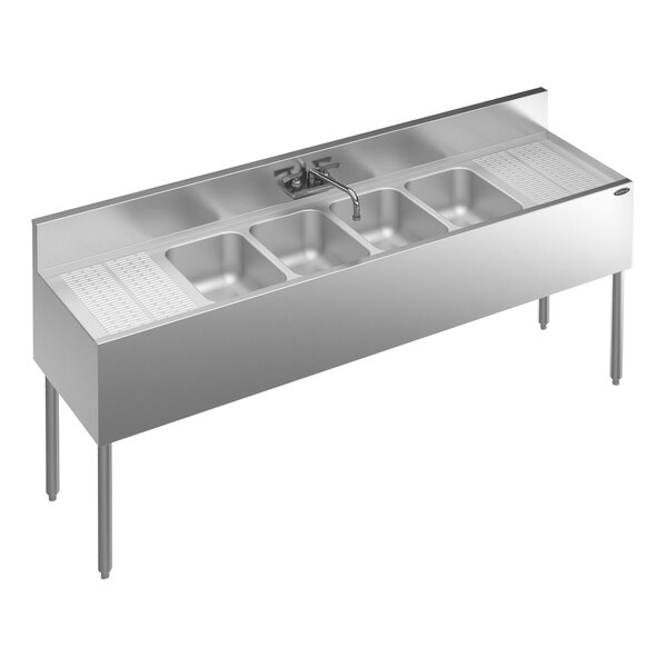 A Krowne stainless steel underbar sink with 4 bowls, 2 drainboards, and a faucet.