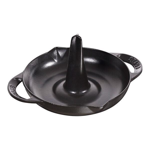 A black cone-shaped Staub enameled cast iron chicken roaster with a handle.