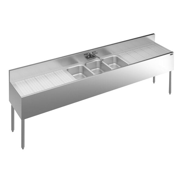 A Krowne Royal Series stainless steel underbar sink with faucet and 2 drainboards.