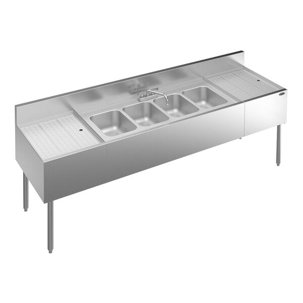 A stainless steel Krowne Royal Series underbar sink with faucet and 2 drainboards.