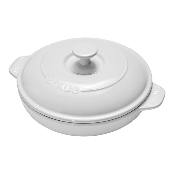 A white round container with a lid.