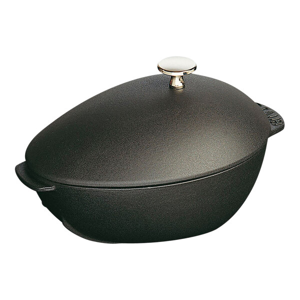 A black enameled cast iron pot with a lid.