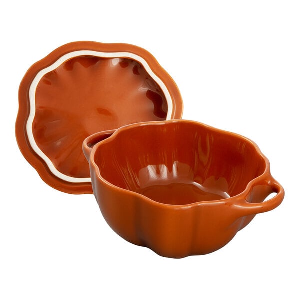 A burnt orange ceramic mini pumpkin bowl with a lid.