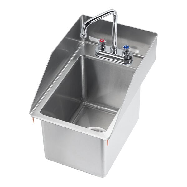 A Krowne stainless steel drop-in sink with side splashes, faucet, and drain.
