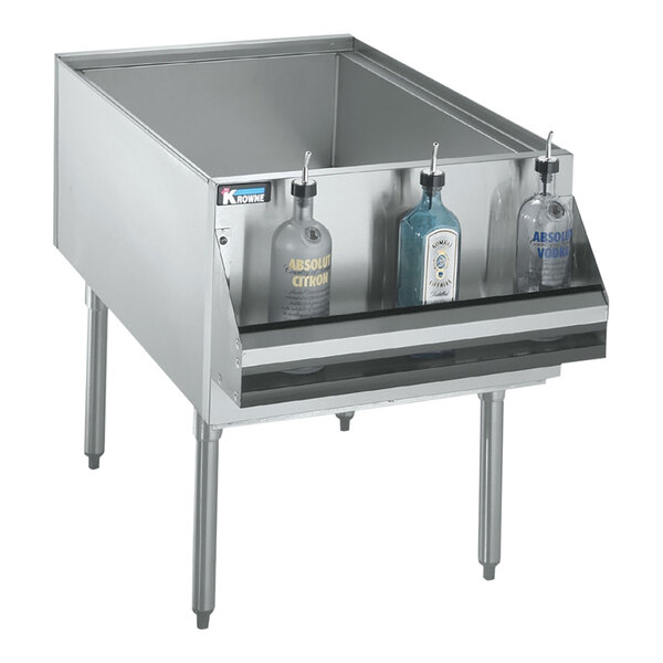 A silver Krowne Royal Series underbar ice bin filled with bottles.