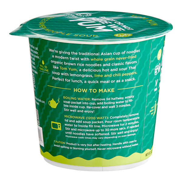 A green Lotus Foods Tom Yum Rice Ramen Noodle Soup cup with white text and a green label.
