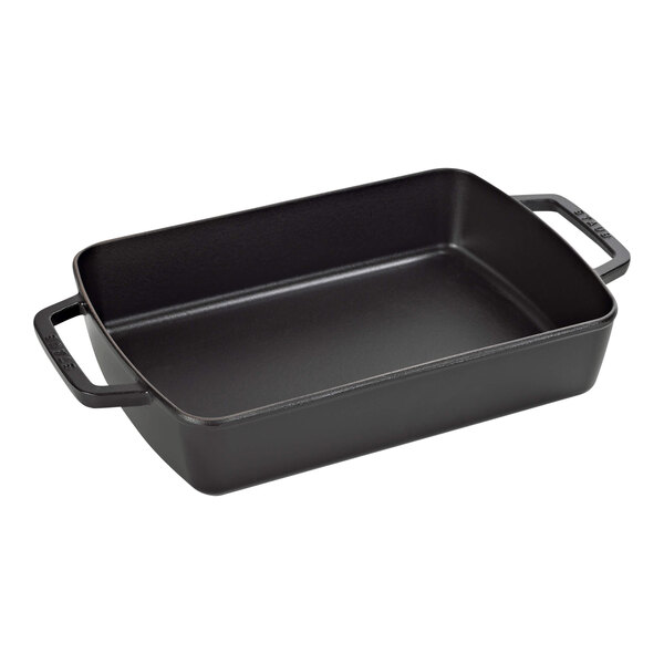 A black rectangular Staub baking dish with handles.