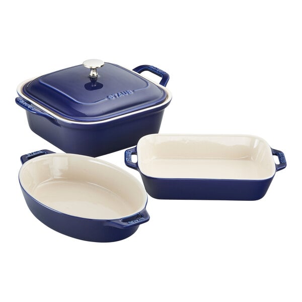 A Staub 4-piece assorted baking dish set in blue and white with a white background.