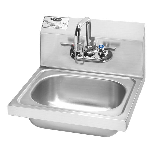 A stainless steel Krowne wall-mounted hand sink with a faucet.