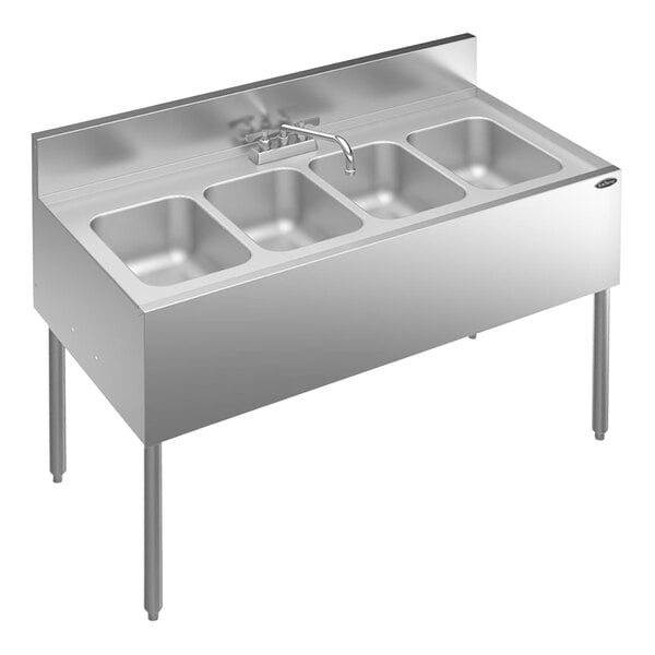 A stainless steel Krowne underbar sink with four bowls and a faucet.