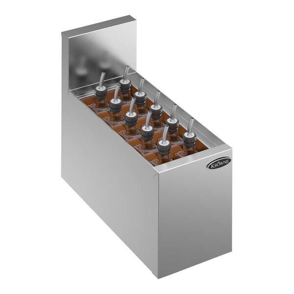 A Krowne stainless steel add-on elixir station with bottles and nozzles.