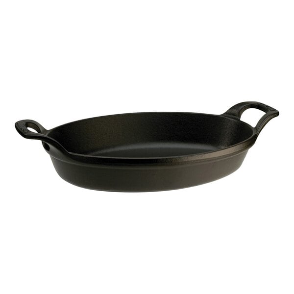 A black enameled cast iron baking dish with two handles.