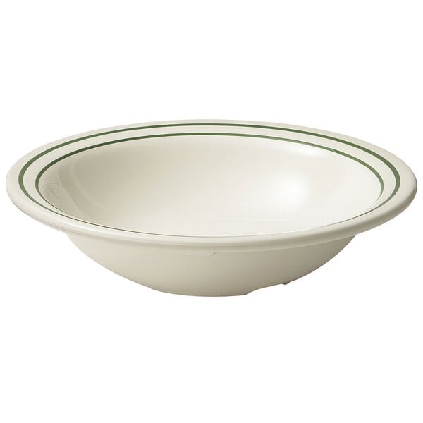 A white bowl with green stripes on it.