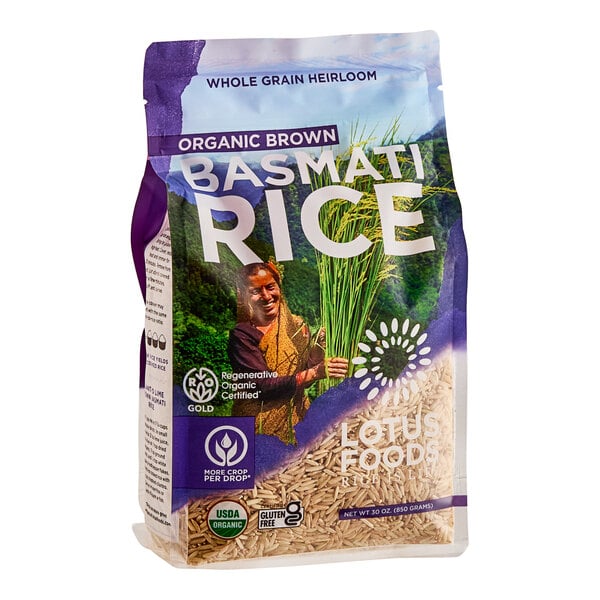 A bag of Lotus Foods Regenerative Organic Long Grain Brown Basmati Rice with a picture of a woman holding a bunch of rice.