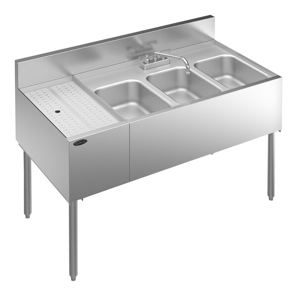 A Krowne stainless steel underbar sink with 3 bowls and a left drainboard and faucet.