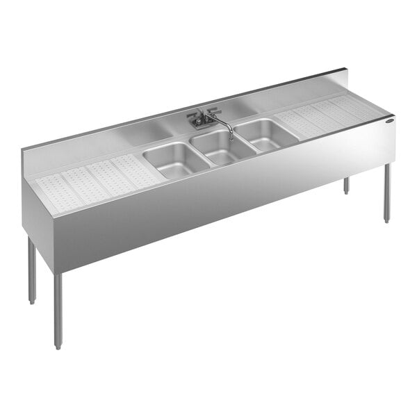 A Krowne Royal Series stainless steel underbar sink with 3 bowls, 2 drainboards, and a faucet.