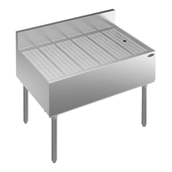 A Krowne stainless steel underbar drainboard with a drain.