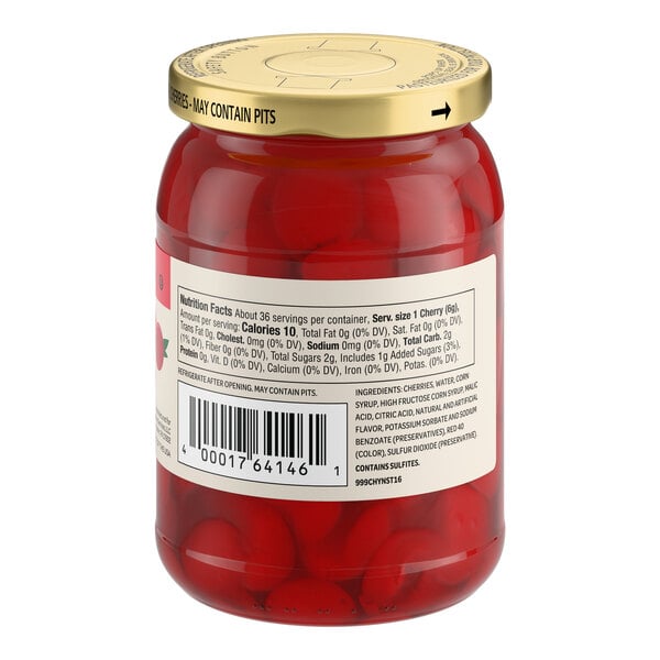 A glass jar of Regal maraschino cherries without stems.