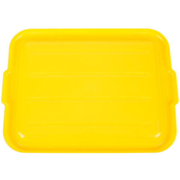 A yellow plastic Vollrath Traex lid for a rectangular food storage box with black lines.