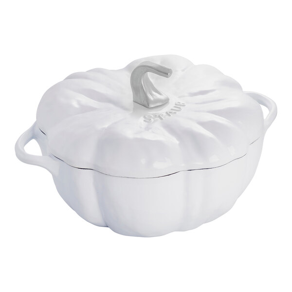 A white Staub enameled cast iron pot with a curved neck and a handle.