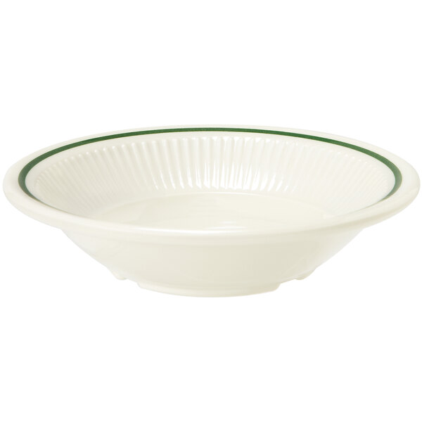 A white bowl with a green rim.