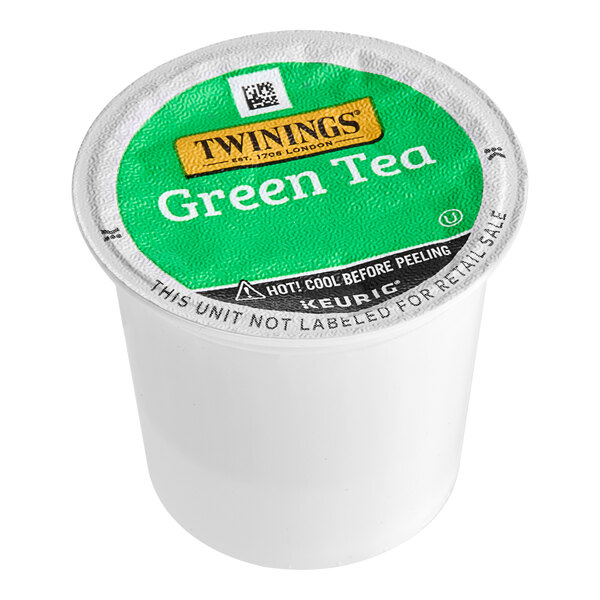 A white Twinings container with a green label for Twinings Green Tea K-Cup Pods.