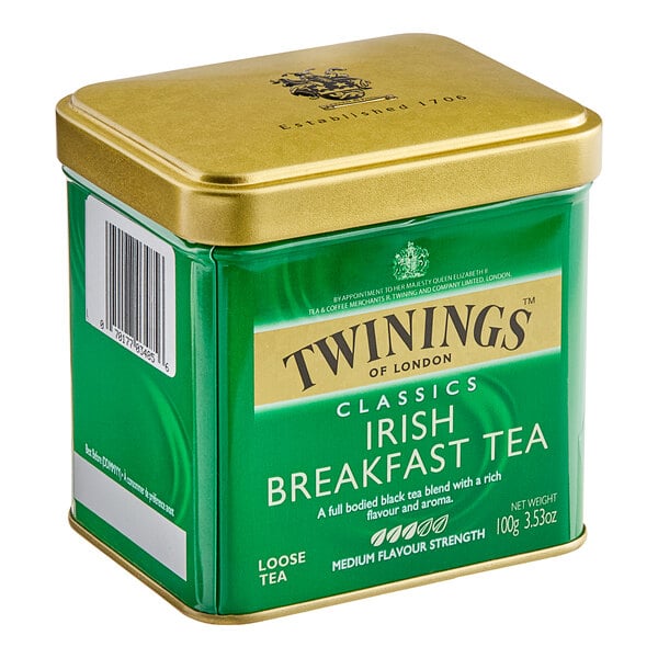 A green and gold Twinings Irish Breakfast loose leaf tea tin.