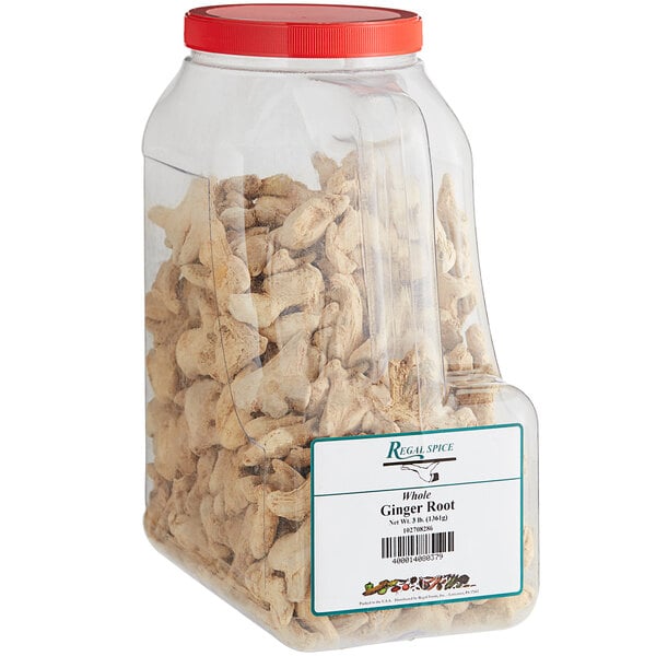 A plastic container of Regal Dried Ginger Root on a white background.