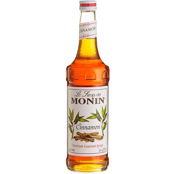 A Monin Premium Cinnamon Flavoring Syrup 750 mL bottle.