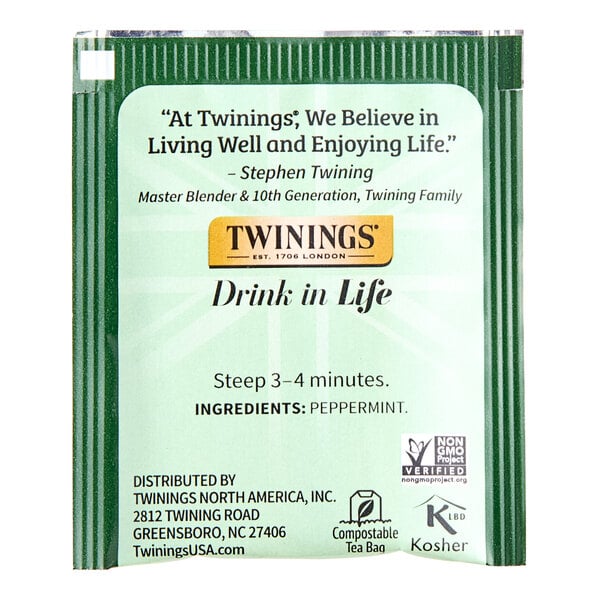A green Twinings package of Pure Peppermint Herbal Tea Bags with black and white text.