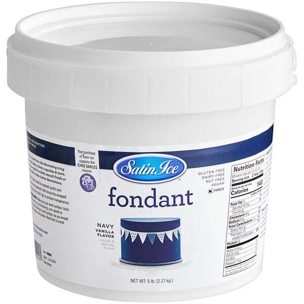 A white container of Satin Ice navy blue rolled fondant with a blue and white label.