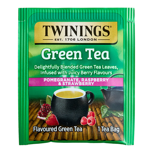 A green package of Twinings Green Tea with Pomegranate, Raspberry, & Strawberry Tea Bags.