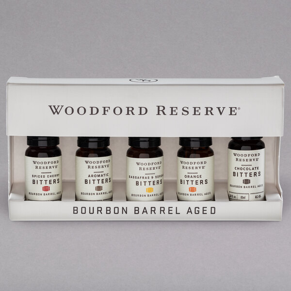 A Woodford Reserve Five-Pack dram set of bitters with labels in a box.