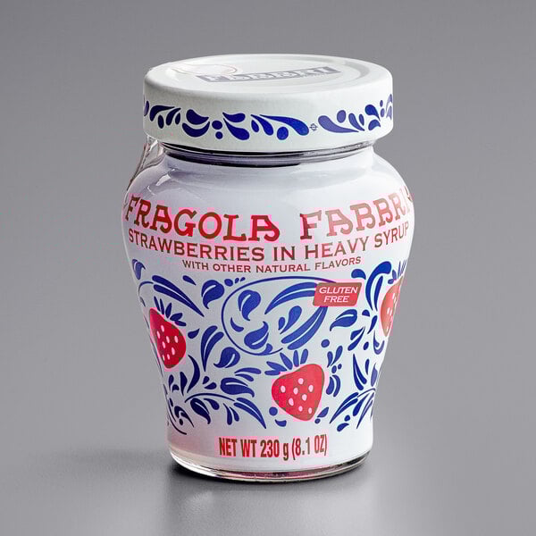 A Fabbri Wild Strawberries in Syrup jar with a lid and label with strawberries on it.