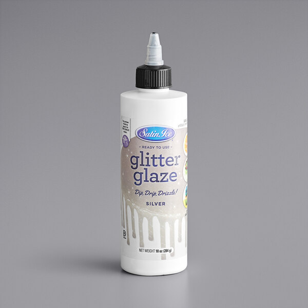A white Satin Ice bottle of silver vanilla glitter glaze with a black cap.