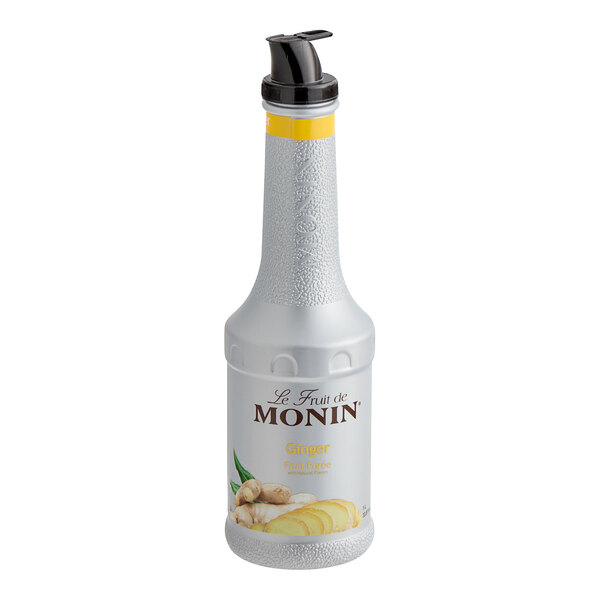 A Monin bottle of ginger fruit puree on a white background.