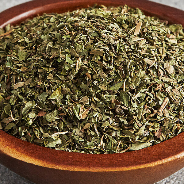 A bowl of Regal dried mint leaves.