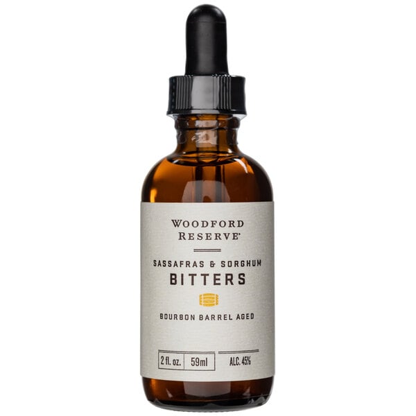 A Woodford Reserve Kentucky Sorghum & Sassafras Bitters bottle with a white label.