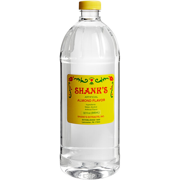 A close up of a Shank's Imitation Almond bottle with a label.